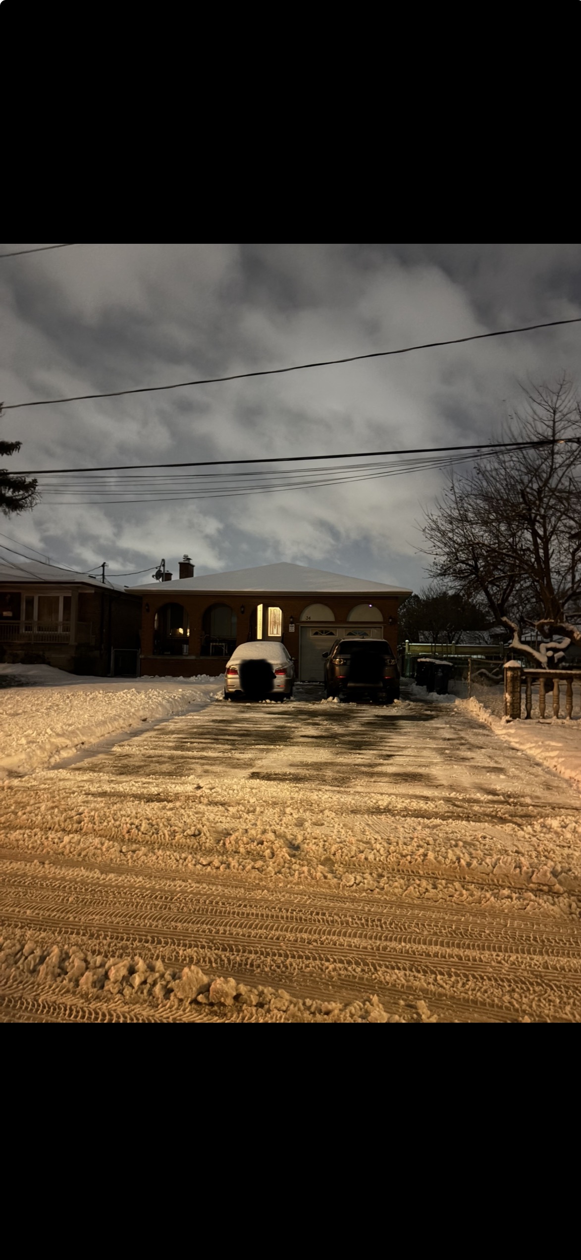 Driveway after evening snow clearing