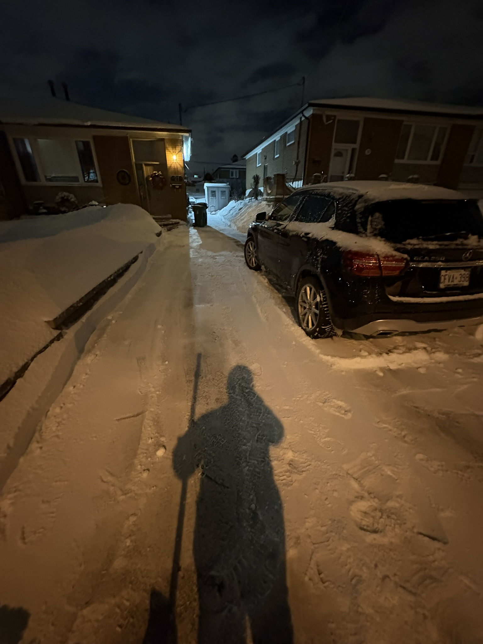 Snow removal beside a house